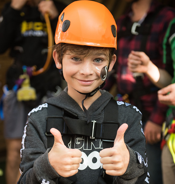 Kids gearing up at Treetops Adventure | Birthday Parties